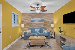Open living space with queen sofa sleeper, and Smart TV