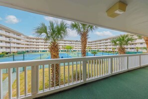 Calming palm and tennis views from the front patio