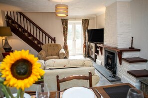 Dining/living room with patio doors leading to the rear garden