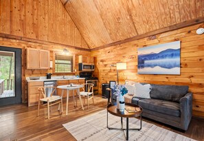 Another look at the inviting living and dining space—great for hanging out, sharing meals, or simply enjoying the cozy cabin vibe.