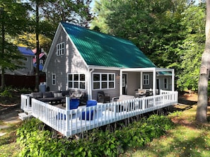 Indulge in outdoor living with our inviting patio, plush seating and covered dining area