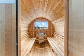 Enjoy the barrel sauna and hot tub on the back deck overlooking the lake