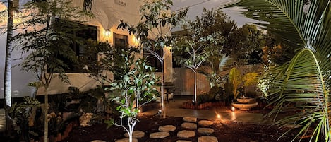 Experience vintage charm with a tropical twist in our 1925 home, surrounded by vibrant native flora