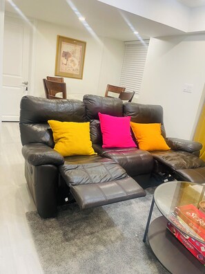 The living room is spacious, cozy, and perfect for relaxation.