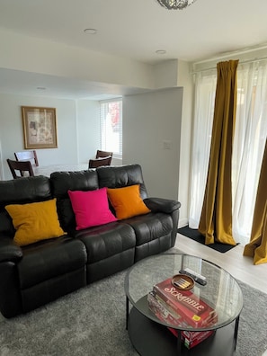 The living room is spacious, cozy, and perfect for relaxation.