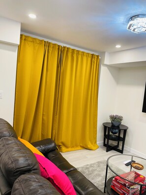 The living room is spacious, cozy, and perfect for relaxation.