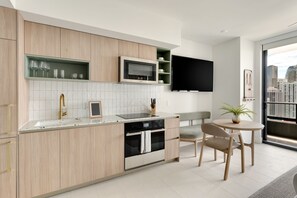 The kitchen is equipped with a drip coffee machine, kettle, and toaster!