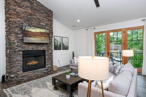Gas Fireplace and TV in the Living Room with a Balcony