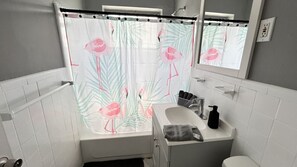 Bathroom with a shower, sink and toilet