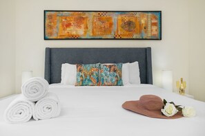 Step into a cozy bedroom adorned with plush, clean linens and soft pillows, designed for ultimate comfort and relaxation.