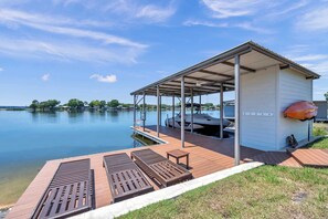 Boat dock has ladder to get in the water and cleats to dock boats