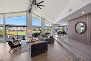 Large windows bring golf course views inside.