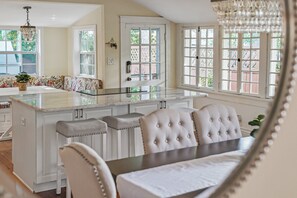 Bright and airy kitchen with a cozy dining nook. Perfect for entertaining or relaxing with a cup of coffee.