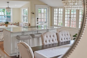 Bright and airy kitchen with a cozy dining nook. Perfect for entertaining or relaxing with a cup of coffee.