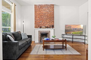Living Room: Where modern comfort meets curated style—unwind in the heart of it all.