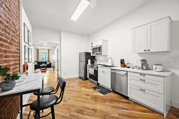 Dining Area: A warm welcome in every seat—share meals, stories, and good times here