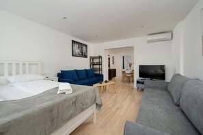 Living area with large double bed.