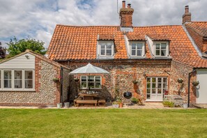 Gable End, Great Snoring: A sunny dining patio for warmer days