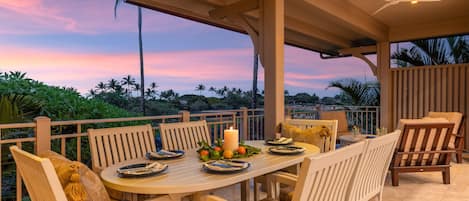 Dine alfresco at sunset with ocean views and warm island breezes.
