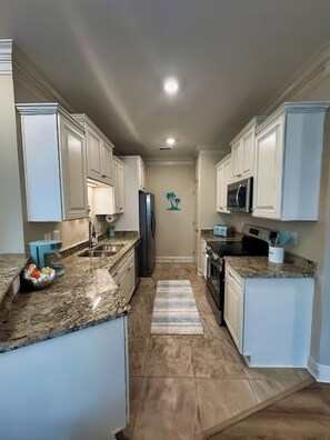 Well equipped kitchen with complimentary coffee bar.