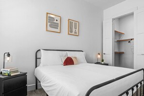 The bedroom offers a luxurious retreat, with a bed that promises restful nights and a room that feels like a private oasis.