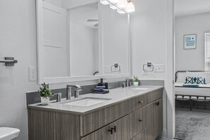 As you step into the bathroom, the clean lines and soothing colors create a space where you can relax and refresh.