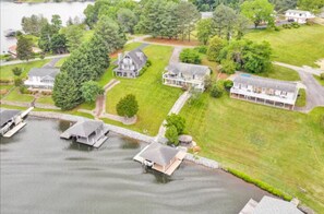 Expansive, open yard with a direct path to the crystal-clear lake, ideal for relaxing by the water's edge.