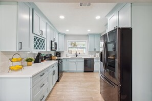 Step into our bright blue & brand-new kitchen—where style meets function! Cook, dine, and unwind in this fresh, modern space!