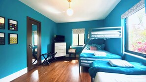 Guest Bedroom - 1 Full & 2 Twins. Fun playroom perfect for the kids. Overlooking the garden, with its own tv for Roku streaming services.