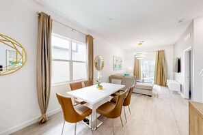 Gather around the spacious dining table, perfect for enjoying meals or game nights with family and friends.