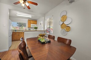 Elegant dining table with four chairs, perfect for family meals.