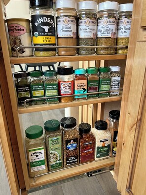 We have a lot of spices, cooking spray, plastic wrap, parchment paper and foil