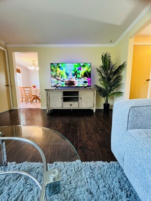 58" inch Roku Tv with LED strips lights. 6 ft artificial plam tree.