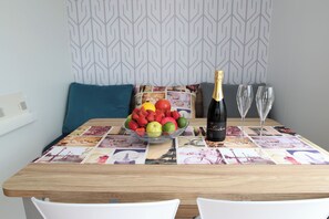 Living room with a dining table and a sofa bed