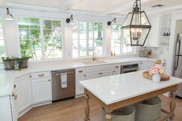 Spacious bright kitchen with a view ready for you to cook together a few memories in the cottage.
