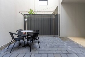 Enjoy the breeze outdoors in your private patio as you gather here for your morning coffee.