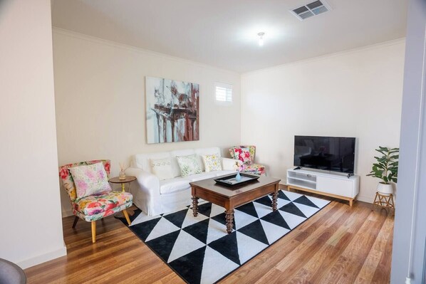 Get comfortable in the lounge room with a spot of TV, or open the doors and create a lovely transition with the outdoors.
