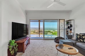 The second living room offers stunning ocean views and access to the balcony.
