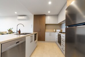Cook up a storm in our modern kitchen, equipped with sleek appliances and everything you need for a hassle-free meal. It’s designed for both convenience and style.