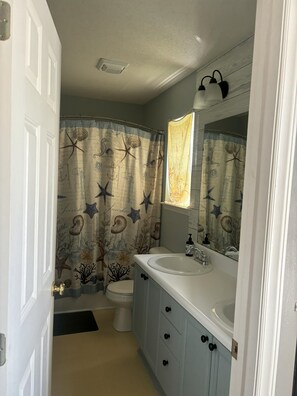 attached to Queen ste. full bathroom, double sink, rain showerhead, spa bath mat