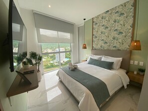 Bright bedroom with mountain view, stylish decor and serene, relaxing atmosphere