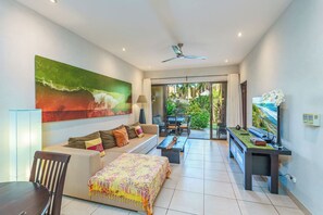Living area with access to the private patio.