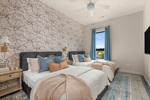 Cozy queen-size beds with plush pillows.