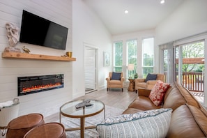 Living Room with fireplace and TV