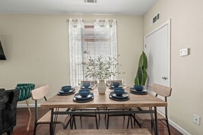 Inviting space with stylish table and seating, perfect for family meals.
