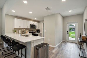 Eat well in the fully stocked kitchen with stainless steel appliances, coffee maker, toaster, and plentiful cookware to make you feel at home.