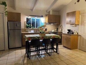 Kitchen table seats up to 6 people. USB ports at end of table/phone/computer. 