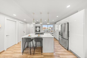 Modern kitchen with a spacious island and stainless steel appliances