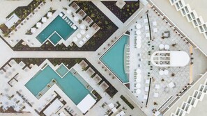 Aerial view of luxury resort pools and cabanas