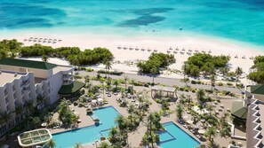 Beachfront paradise with lush gardens and infinity pools 